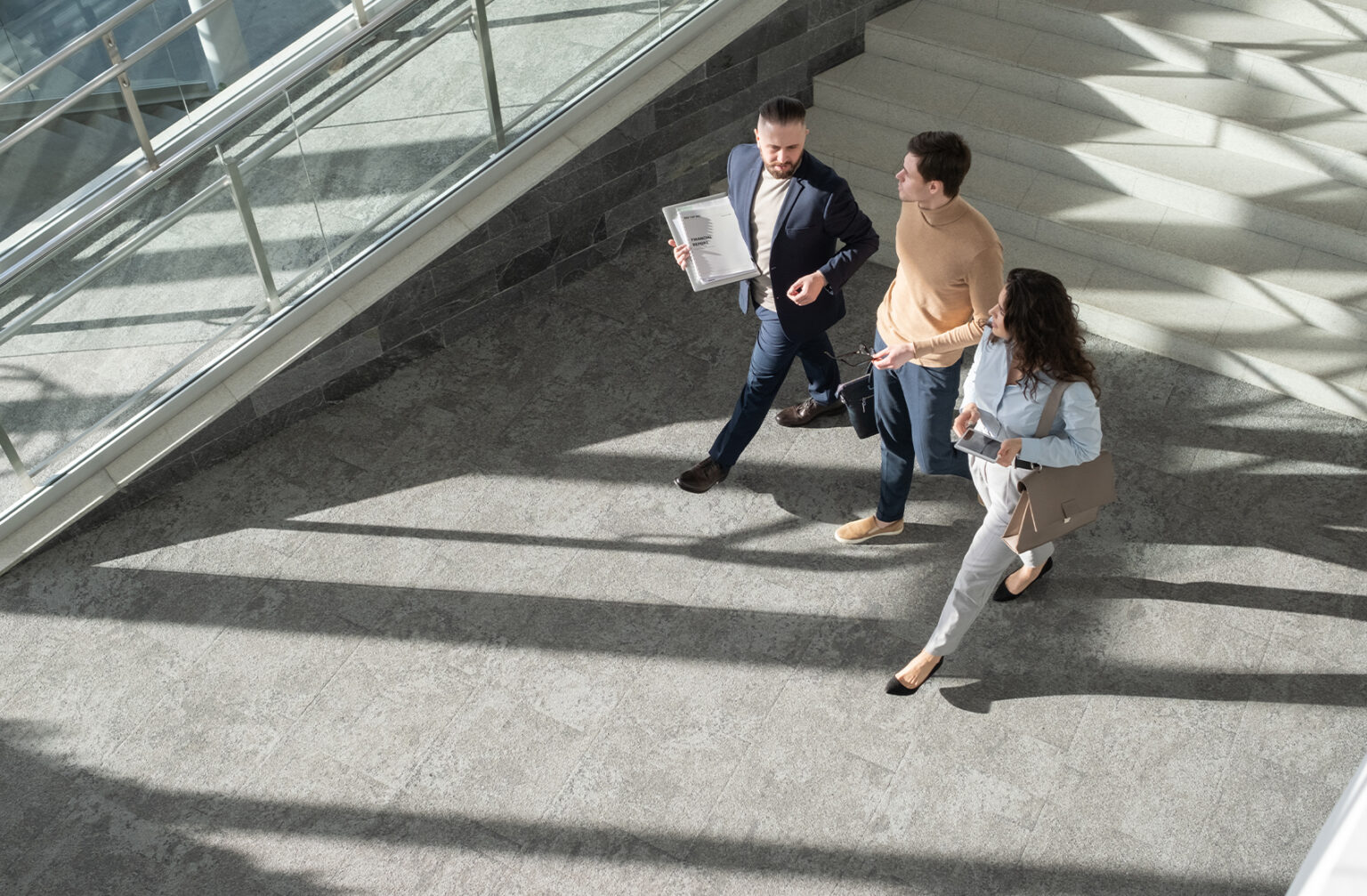 Two businessman sitting on the stairs talking